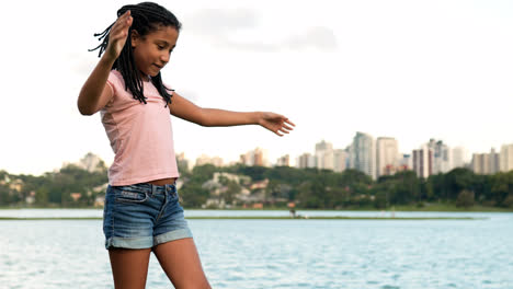 Girl-doing-pirouette-at-the-park